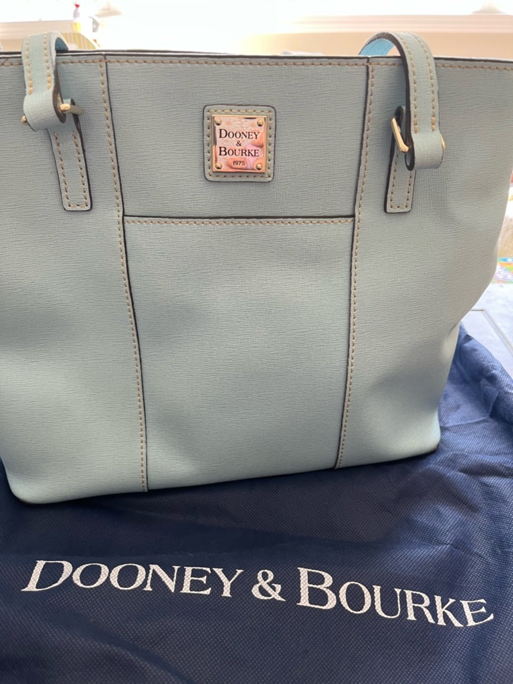 Dooney & Bourke Pebble Grain Small Lexington tote bag in a light blue color.